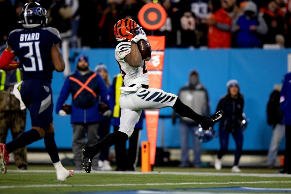 Cincinnati Bengals running back Joe Mixon (28) scores a touchdown in the third quarter during an NFL divisional playoff football game, Saturday, Jan. 22, 2022, at Nissan Stadium in Nashville, Tenn. Cincinnati Bengals defeated Tennessee Titans 19-16.