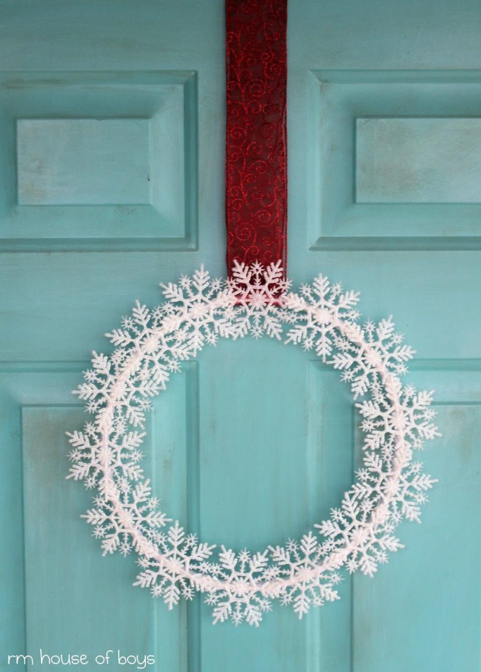<p>Hang a wreath full of snowflakes from a bold ribbon for a color-block effect on an icy blue door (or any color door, really). You'll need white felt and an embroidery hoop.</p><p><a class="link " href="https://www.amazon.com/kockuu-Snowflakes-Snowflake-Ornaments-Decorations/dp/B07ZNJSMCD?tag=syn-yahoo-20&ascsubtag=%5Bartid%7C10067.g.42146682%5Bsrc%7Cyahoo-us" rel="nofollow noopener" target="_blank" data-ylk="slk:Shop Now;elm:context_link;itc:0">Shop Now</a><br><br><em><a href="http://rmhouseofnoise.blogspot.com/2011/11/snowflakes-keep-falling-on-my-head.html" rel="nofollow noopener" target="_blank" data-ylk="slk:Get the tutorial at RM House of Boys »;elm:context_link;itc:0" class="link ">Get the tutorial at RM House of Boys »</a></em> </p>