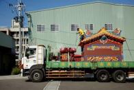 A ready-made Chinese traditional temple is seen on a lorry during delivery to a customer in Taichung, Taiwan July 6, 2016. REUTERS/Tyrone Siu