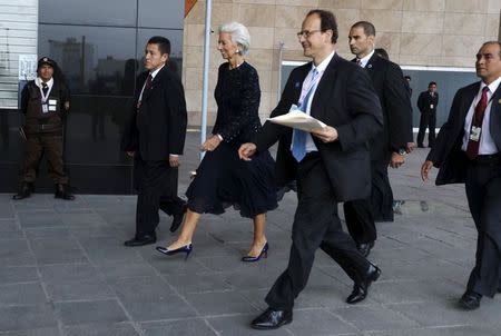 International Monetary Fund (IMF) Managing Director Christine Lagarde (C) walks at the venue of the 2015 IMF/World Bank Annual Meetings in Lima, Peru, October 9, 2015. REUTERS/Guadalupe Pardo