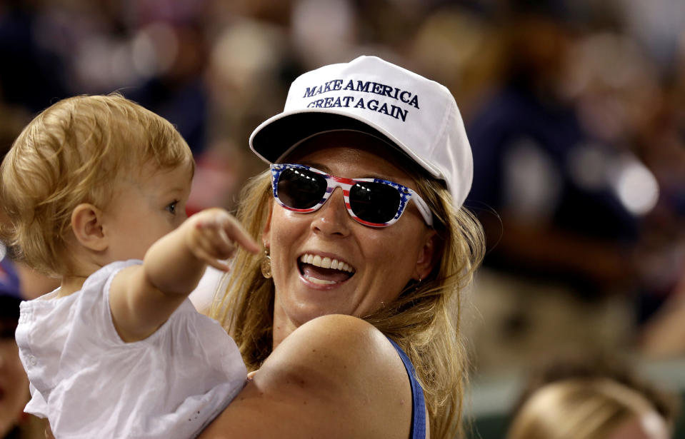 <p>Katie Lewis carries Ellie Brooker, 14 months old, as the Democrats and Republicans face off in the annual Congressional Baseball game at Nationals Park in Washington, June 15, 2017. (Photo: Joshua Roberts/Reuters) </p>