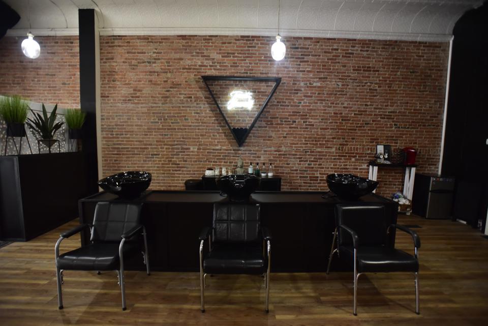 Three different hair care stations inside the Infinite Beauty & Wellness located on 914 Military Street adjacent to Magic Hat Tattoo and the Raven Cafe in downtown Port Huron on Friday, Nov. 11, 2022.