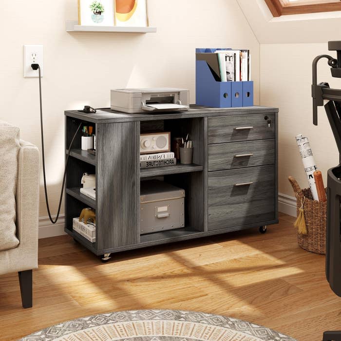 the dark gray filing cabinet