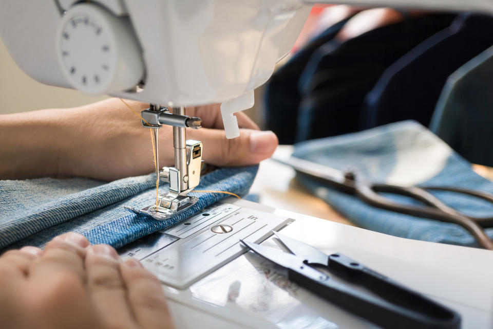 Person working on a sewing machine