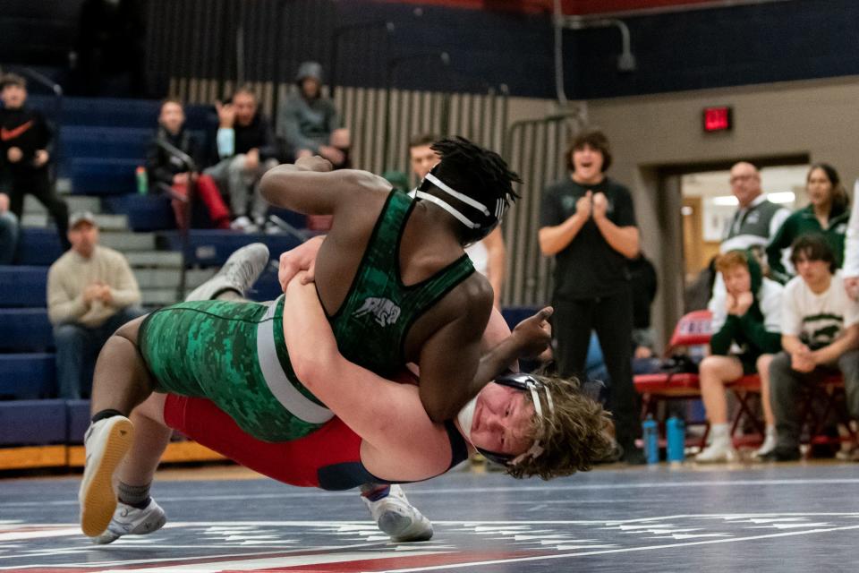 Central Bucks East's Joe Collins, bottom, wrestles Pennridge's Chase Washington in a 285-pound match during a duals meet, on Wednesday, January 12, 2021, at Central Bucks East High School in Buckingham. The Rams narrowly defeated the Patriots 30-29.