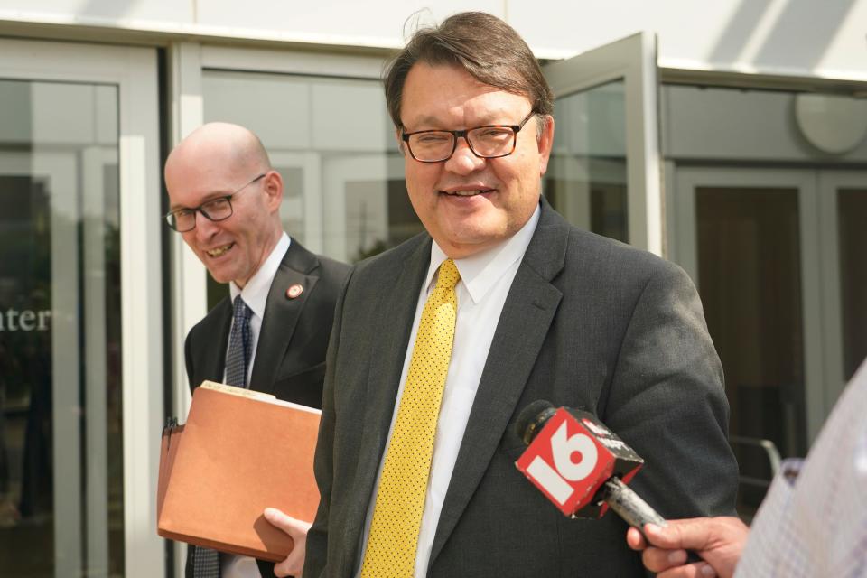 Attorneys Gerald Kucia, left, and Rex Shannon, both with the Mississippi Attorney General's Office, exit the Thad Cochran United States Courthouse in Jackson on Monday, May 22, following a day in federal court where a judge heard arguments about a Mississippi law that would create a court system with judges who would be appointed rather than elected.