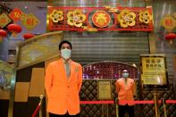 Security guards stand outside the closed Grand Lisboa casino, following the coronavirus outbreak in Macau