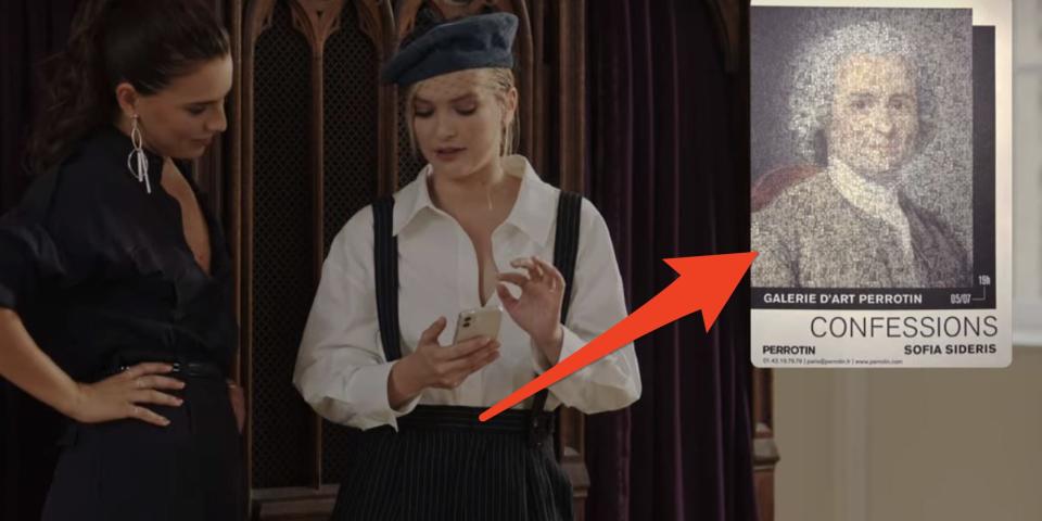 camille showing sofia her exhibit poster on her phone on emily in paris season three episode four