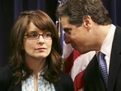 Tina Fey chats world domination with New York governor-elect Andrew Cuomo. Mark Lennihan/Associated Press