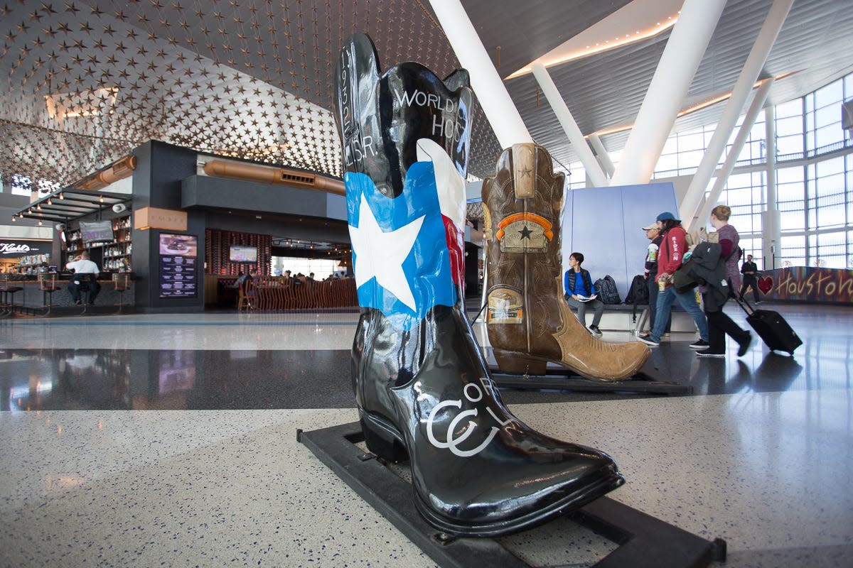 A giant cowboy boot adorned with the Texas flag sits in Terminal C at George Bush Intercontinental Airport in Houston.