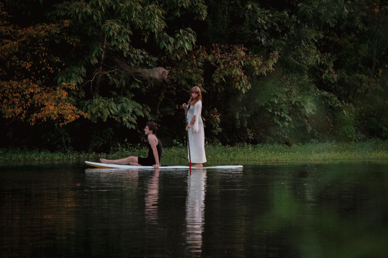 Elizabeth Braaten Palmieri, right, wades Jacob Blank through the water at the beginning of the play during GreenHouse Theatre Project’s production of “LAKE//SHAKES” last year. Palmieri directs the upcoming GreenHouse production of "Lungs."