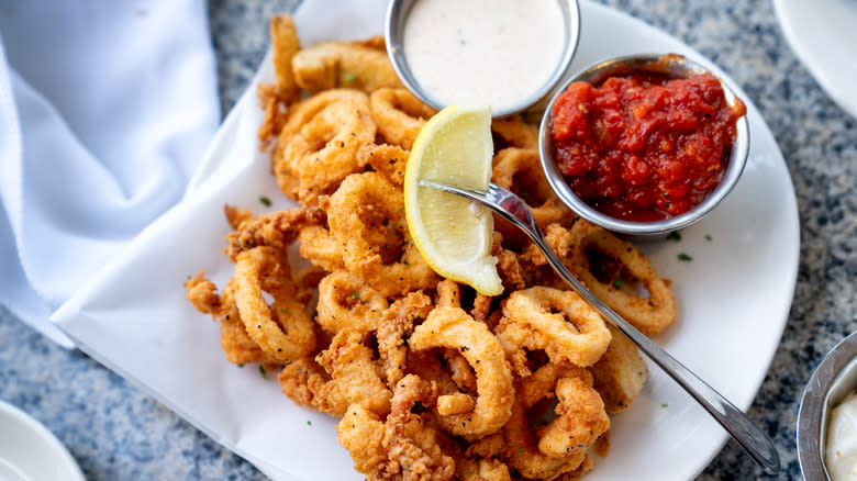 Fried calamari and sauces on plate