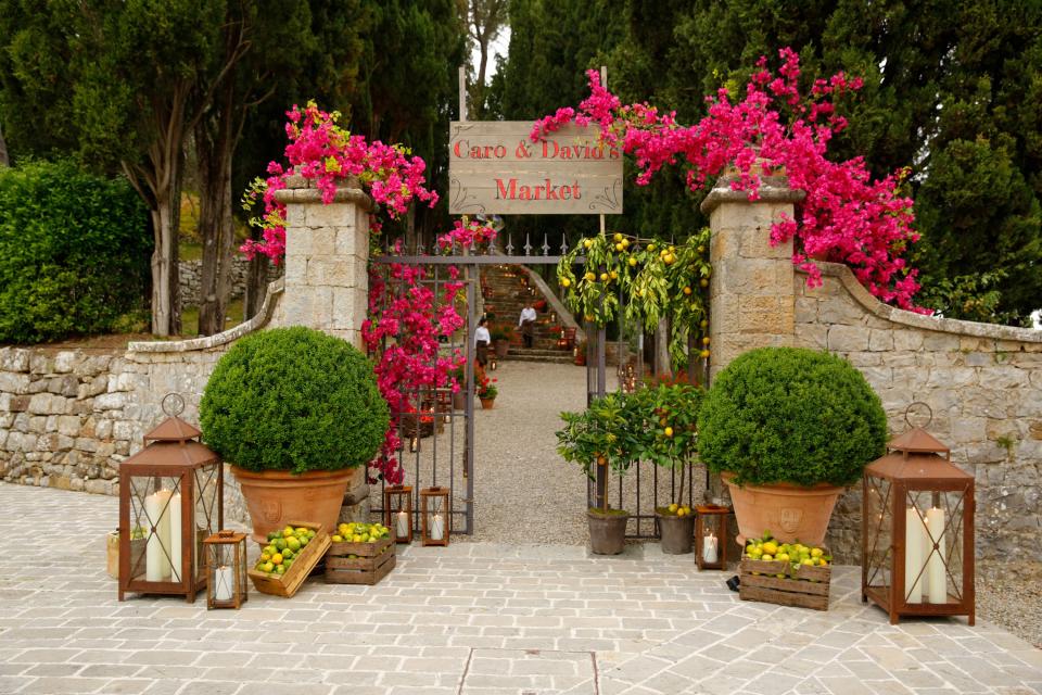 On Friday night, guests climbed the steps leading to the castle ruins at Castiglion del Bosco for the market-themed rehearsal dinner.