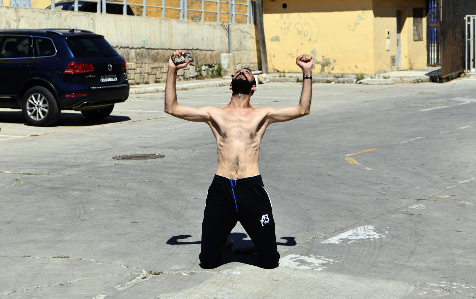 A man from Morocco reacts after entering swimming into the Spanish territory, at the Spanish enclave of Ceuta on Monday, May 17, 2021. Authorities in Spain say that around 1,000 Moroccan migrants have crossed into Spanish territory (Antonio Sempere/Europa Press via AP)