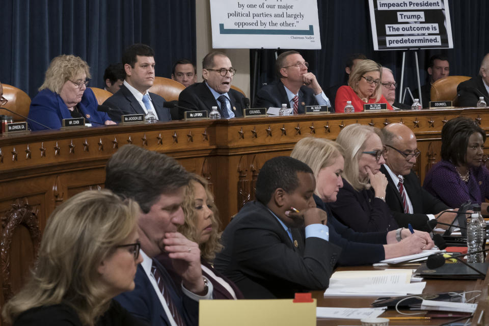 House Judiciary Committee Chairman Jerrold Nadler, D-N.Y., top center, and Rep. Doug Collins, R-Ga., the ranking member, right, makes his opening statement during a markup of the articles of impeachment against President Donald Trump, on Capitol Hill in Washington, Wednesday, Dec. 11, 2019. The Democratic members of the panel are on the bottom row. (AP Photo/J. Scott Applewhite)