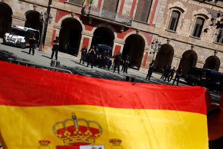 A group that broke away from the main pro-union demonstration organised by the Catalan Civil Society organisation protests outside the regional parliament as Catalonian regional police look on in Barcelona, Spain October 8, 2017. REUTERS/Juan Medina