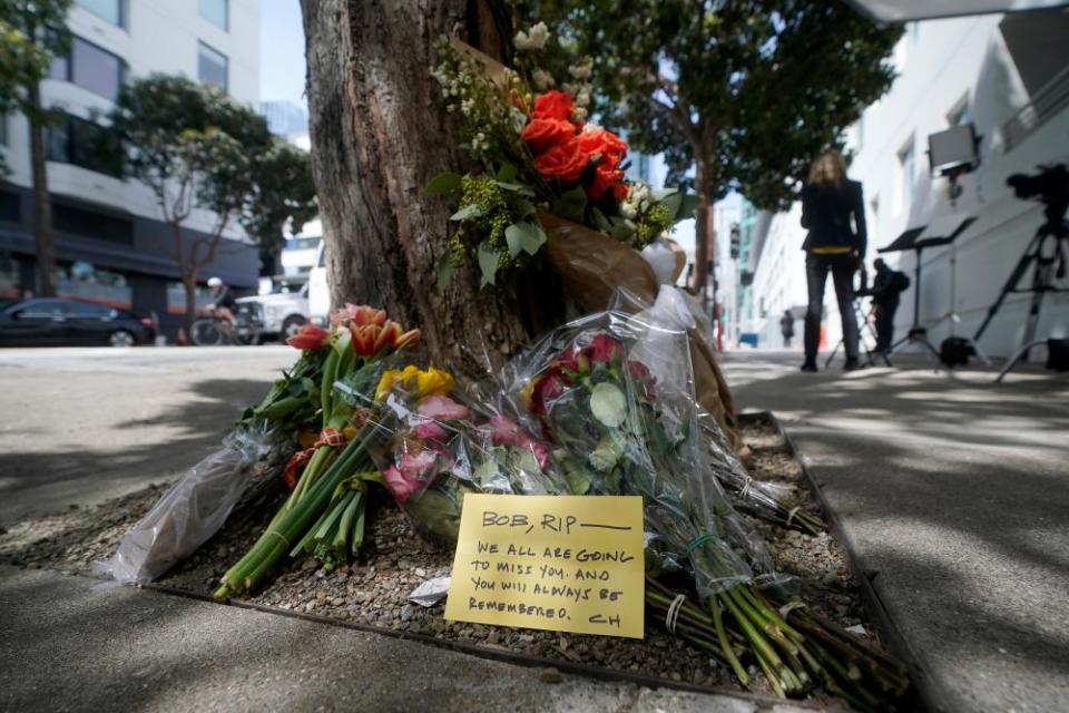 Flowers in front of the building where Bob Lee was fatally stabbed outside of in San Francisco.