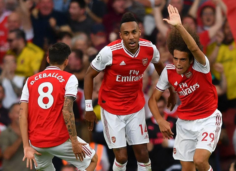 Gabonese striker Aubameyang (centre) rescued a point for Arsenal. (Photo credit BEN STANSALL/AFP/Getty Images)