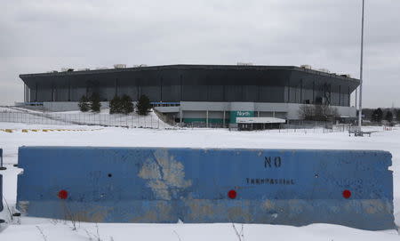 A 'no trespassing' barricade blocks an entrance to the parking lot of the vacant Pontiac Silverdome, former home of the Detroit Lions NFL team, in Pontiac, Michigan in a January 13, 2016 file photo. REUTERS/Rebecca Cook/Files