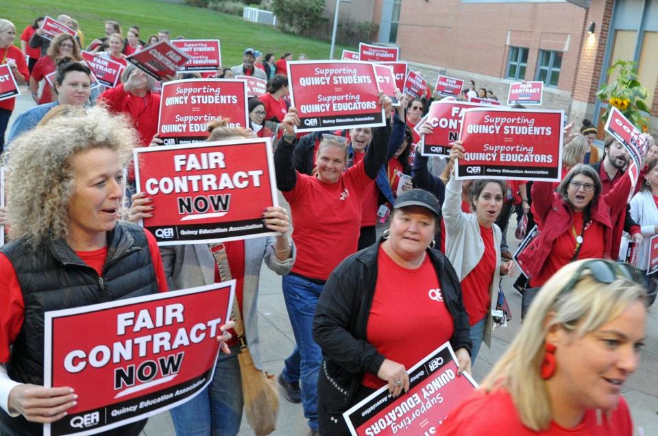 Quincy Public School teachers march to the Quincy Public Schools administration building.