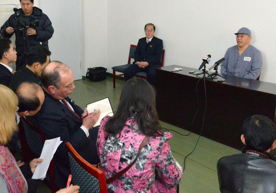 Kenneth Bae (R), a Korean-American Christian missionary who has been detained in North Korea for more than a year, meets a limited number of media outlets in Pyongyang, in this photo taken by Kyodo January 20, 2014. U.S. missionary Kenneth Bae, imprisoned in reclusive North Korea for more than a year, said on Monday he wants to return to his family as soon as possible and hopes the United States will help, Japan's Kyodo news agency reported. (REUTERS/Kyodo)