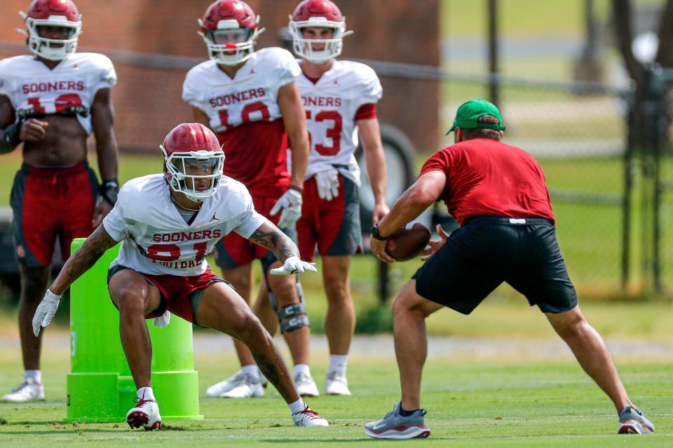 A "Hard Knocks" video shown to OU's football team during camp gave OU safety Reggie Pearson (21) a different perspective as he battles for starting role.