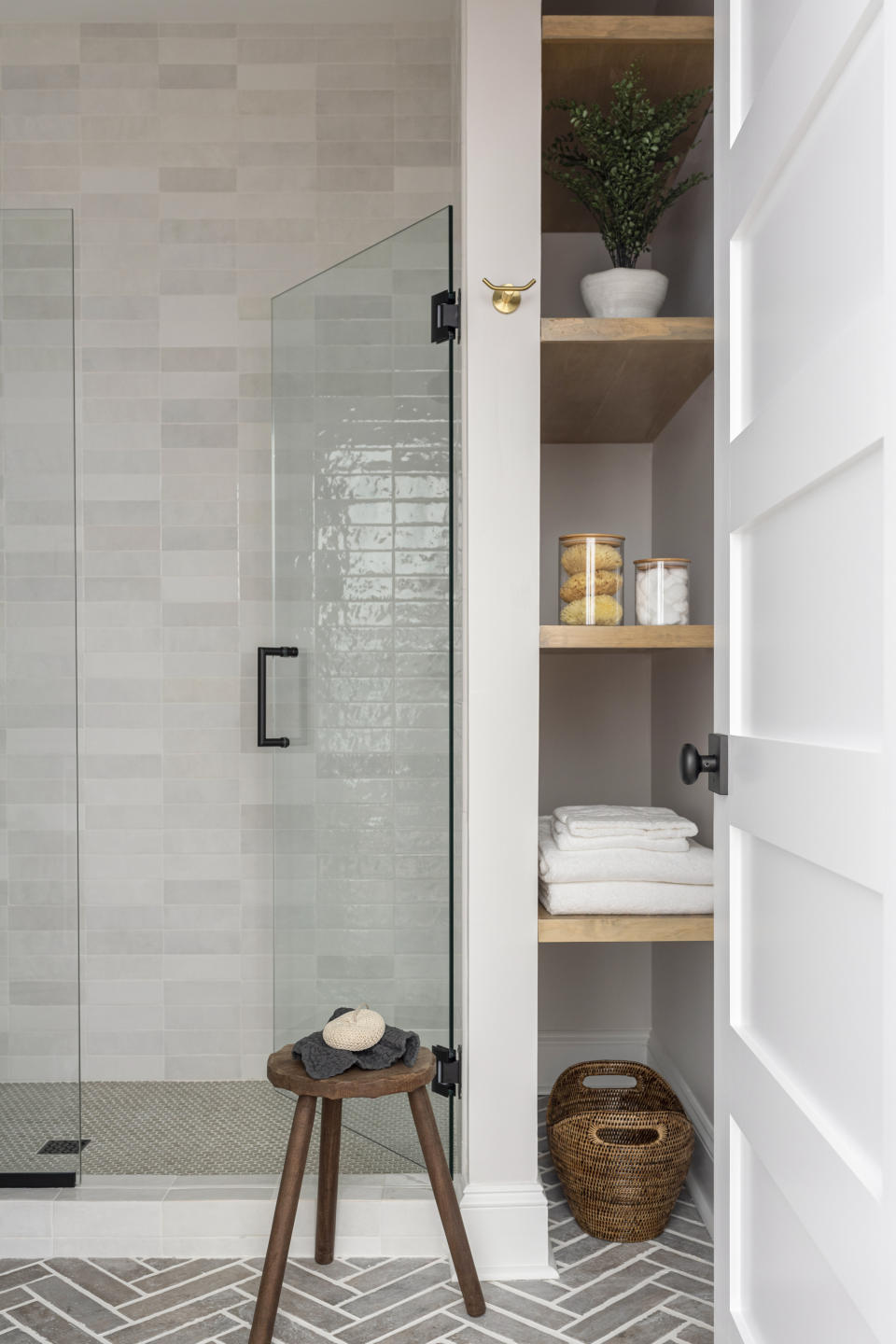 A bathroom with vertical storage