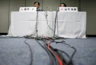 Mitsubishi Motors Corp's Chairman and Chief Executive Officer Osamu Masuko (L) and Head of Research and Development Mitsuhiko Yamashita attend a news conference in Tokyo, Japan August 30, 2016. REUTERS/Kim Kyung-Hoon