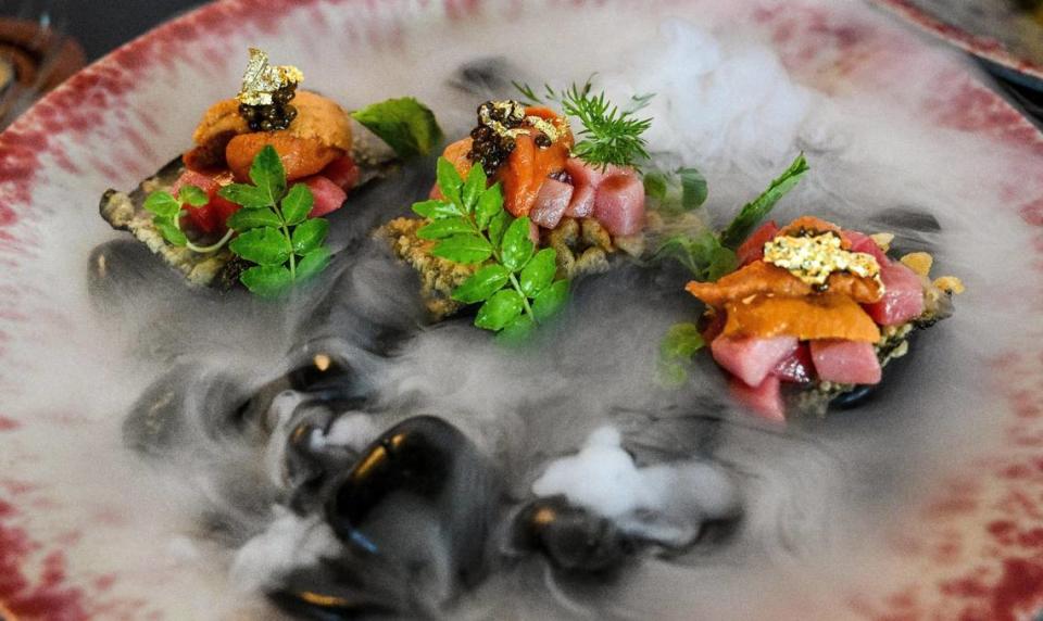 Uni, or sea urchin, with shiso and caviar comes with dry ice fog pouring off the rocks it’s served on at O-iza Japanese Cuisine in the River Park shopping center. CRAIG KOHLRUSS/ckohlruss@fresnobee.com