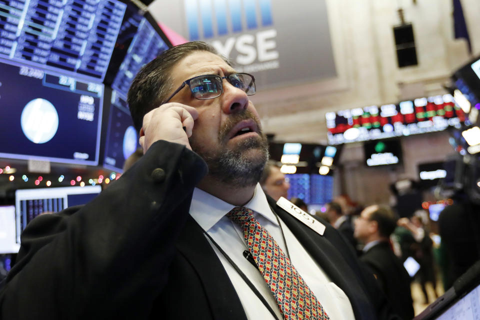 Trader Robert Oswald works on the floor of the New York Stock Exchange, Thursday, Dec. 6, 2018. U.S. stocks tumbled in early trading Thursday following a sell-off in overseas markets. (AP Photo/Richard Drew)