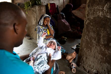 The Wider Image: Tanzania's Zanzibar begins to register traditional healers