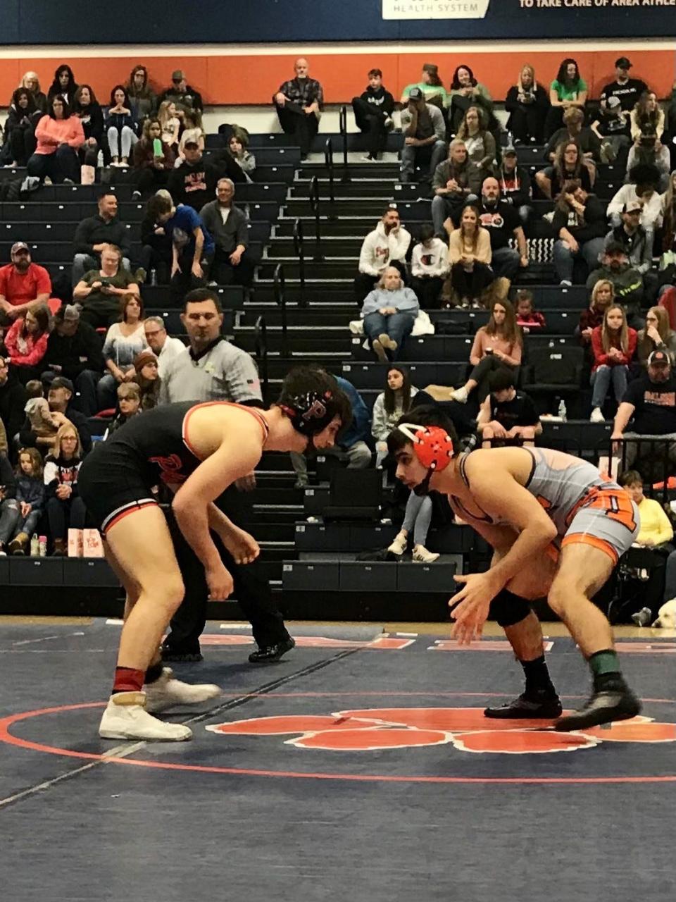 Pleasant's Skyler Wolf, left, competes at the Mid Ohio Athletic Conference Wrestling Tournament at Galion last season.