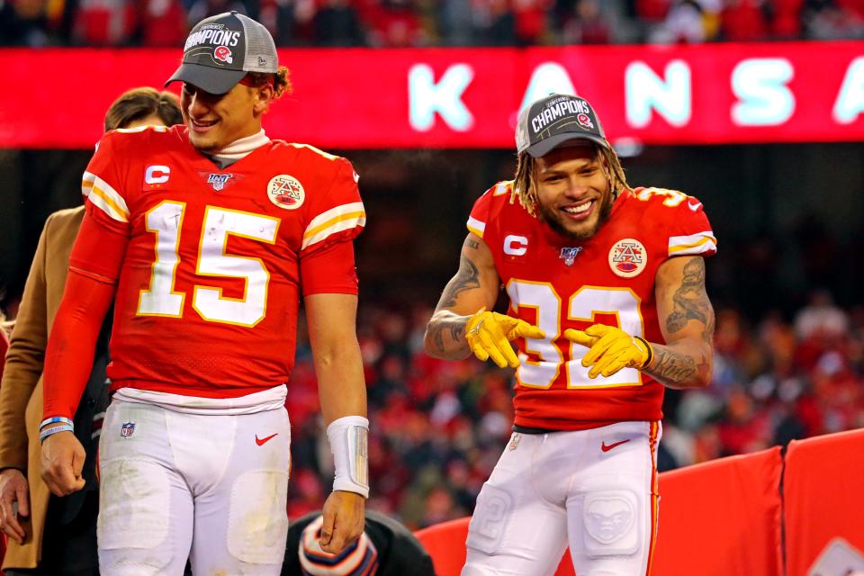 Jan 19, 2020; Kansas City, Missouri, USA; Kansas City Chiefs strong safety Tyrann Mathieu (32) and quarterback Patrick Mahomes (15) celebrate after beating the Tennessee Titans in the AFC Championship Game at Arrowhead Stadium. Mandatory Credit: Jay Biggerstaff-USA TODAY Sports