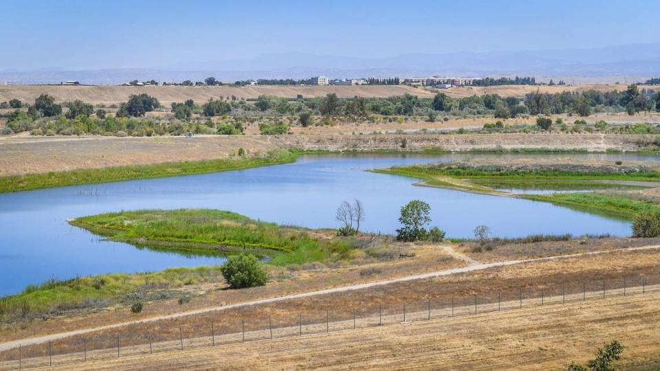 The River West Fresno Open Space Area as seen from Spano Park in northwest Fresno with Valley Children’s Hospital in Madera County visible in the distance on Tuesday, June 22, 2021.