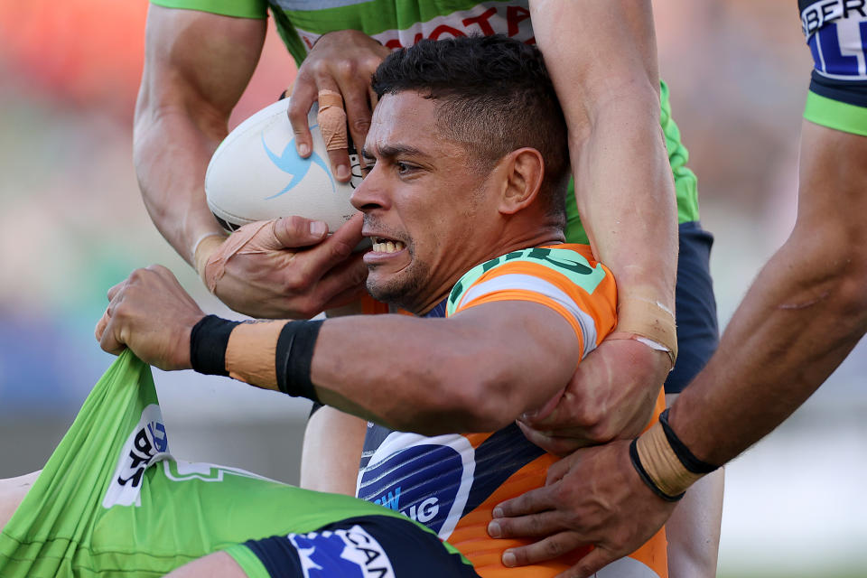 Seen here, Newcastle's Dane Gagai being tackled during the round 23 NRL match against the Canberra Raiders. 