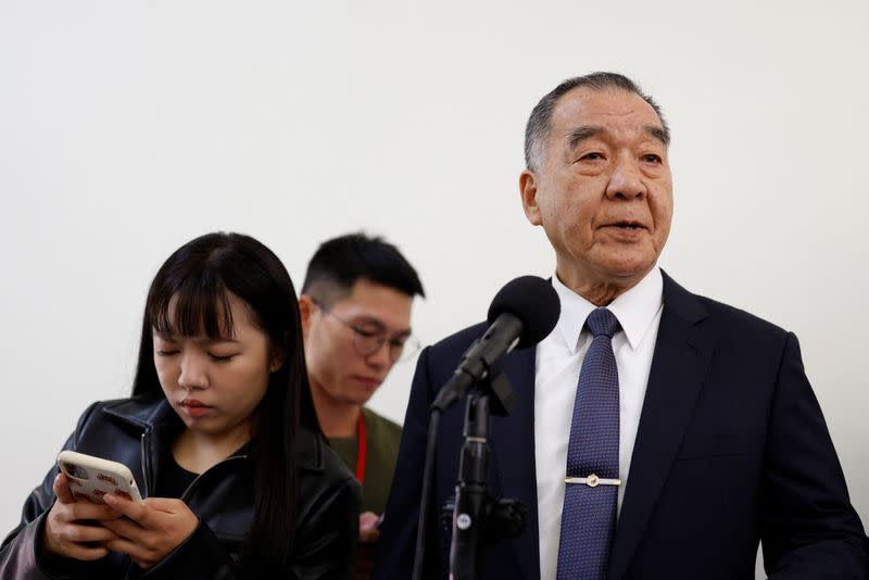 Taiwan's Defence Minister Chiu Kuo-cheng talks to the media before attending a parliament session in Taipei