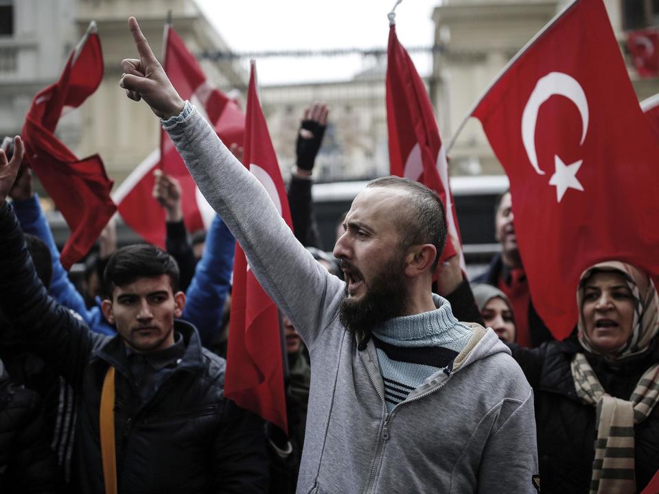 Dutch police used dogs and water cannons to disperse hundreds of protesters who gathered outside the Turkish consulate in Rotterdam: AP