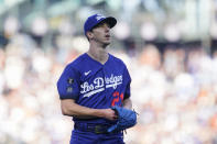 Los Angeles Dodgers pitcher Walker Buehler walks to the dugout after the third inning of a baseball game against the San Francisco Giants in San Francisco, Sunday, Sept. 5, 2021. (AP Photo/Jeff Chiu)