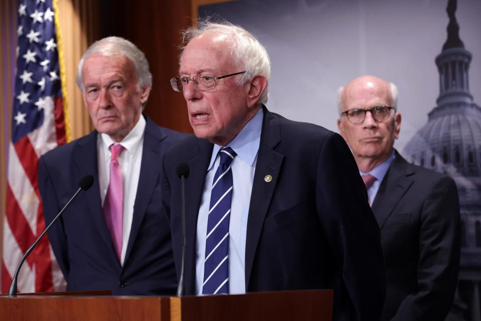 U.S. Sen. Bernie Sanders (I-VT) (2nd L) speaks as Sen. Ed Markey (D-MA) (L) and Sen. Peter Welch (D-VT) (R) listen during a news conference on debt limit at the U.S. Capitol on May 18, 2023 in Washington, DC. A group of Senate Democrats have sent a letter to President Joe Biden urging him to invoke the 14th Amendment of the U.S. Constitution to avoid a debt default if he can’t reach to a deal with Republicans.