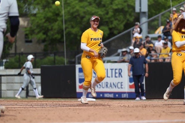 Missouri first baseman Emma Raabe smiles after making out against Arizona in the NCAA Columbia Regional Final on May 22, 2022.
