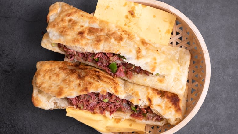 Meat sandwiches in woven basket 