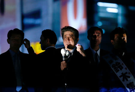 Japan's Prime Minister Shinzo Abe, who is also ruling Liberal Democratic Party leader,makes a speech at an election campaign rally in Tokyo, Japan October 18, 2017. REUTERS/Toru Hanai