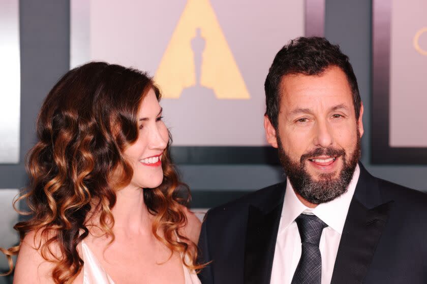 Los Angeles, CA - November 19: Adam and Jackie Sandler walk the red carpet at the Academy of Motion Picture Arts and Sciences 13th Governors Awards at the Fairmont Century Plaza on Saturday, Nov. 19, 2022 in Los Angeles, CA. (Dania Maxwell / Los Angeles Times)