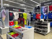 Signage and clothes of the brand Reebok are seen at a Walmart's newly remodeled store, in Teterboro