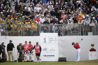 U.S. team player and captain Tiger Woods tees off during their fourball match of the opening rounds of the President's Cup Golf tournament in Melbourne, Thursday, Dec. 12, 2019. (AP Photo/Andy Brownbill)