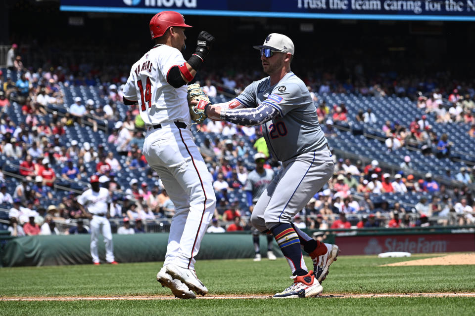 New York Mets first baseman Pete Alonso, right, tags out Washington Nationals' Ildemaro Vargas during the fifth inning of a baseball game, Thursday, July 4, 2024, in Washington. (AP Photo/Nick Wass)