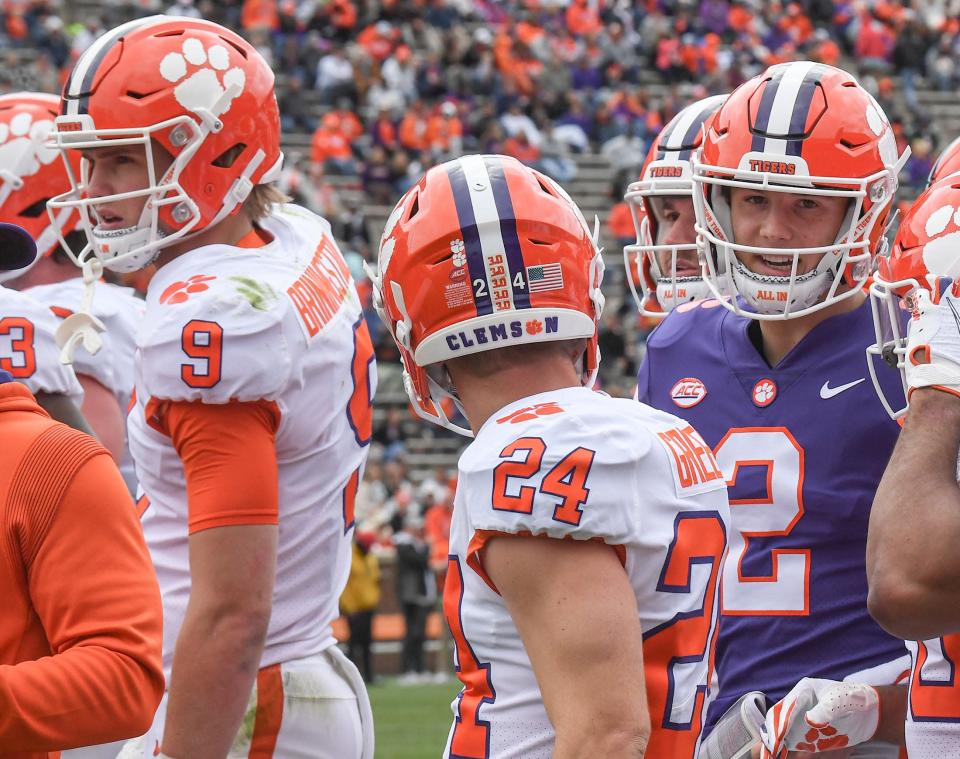 White squad tight end Jake Briningstool (9), wide receiver Hamp Greene (24) and quarterback Cade Klubnik (2) talk during the April 9 spring game.