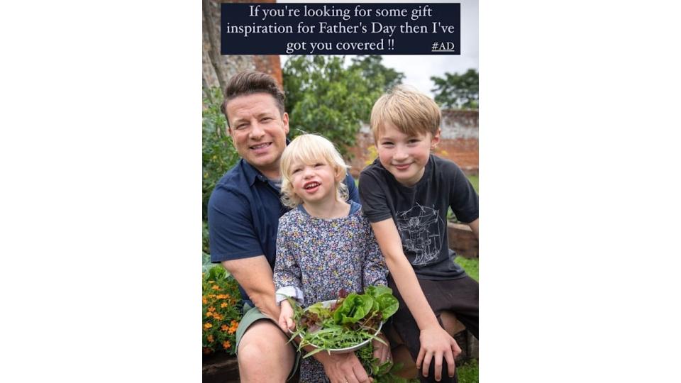 Jamie Oliver smiling with his two sons