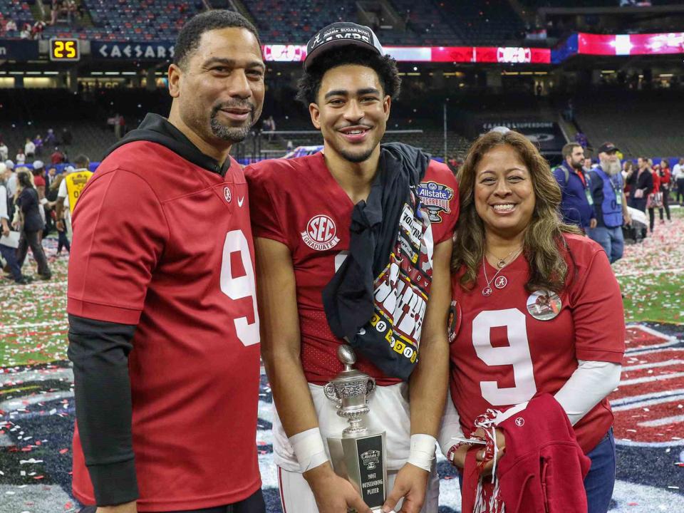 <p>Jonathan Mailhes / Cal Sport Media / Alamy</p> Bryce Young and his parents, Craig and Julie Young, after the 89th annual Allstate Sugar Bowl between the Alabama Crimson Tide and the Kansas St. Wildcats in December 2022.