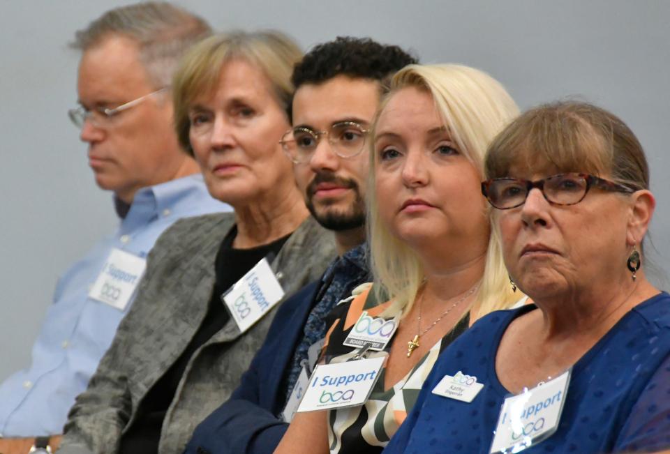 Brevard Cultural Alliance Executive Director Kathy Engerran, at right, and other supporters of the arts listen to Brevard County Commission debate related to arts funding on Aug. 22.